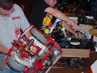 Dan Provenzo and Ed Mcarron work furiously in the pits.